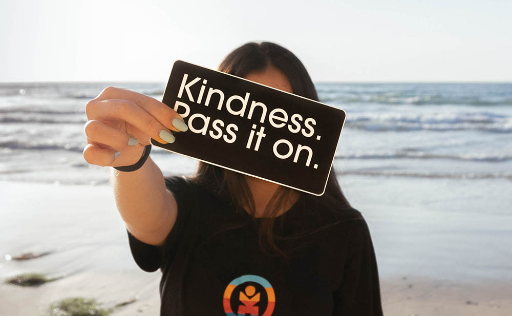 Woman Holding a Kindness Sign